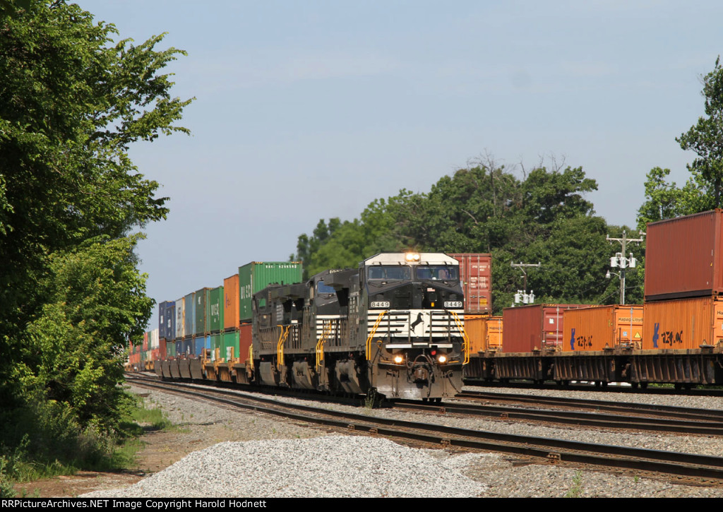 NS 8449 has left its train (214) on the main to make a pickup